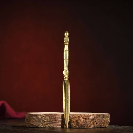 Alt Text: Handcrafted Tibetan Buddhist Vajra Phurba made from brass with a base, symbolizing spiritual protection and strength. Perfect for Buddhist altars and rituals.
