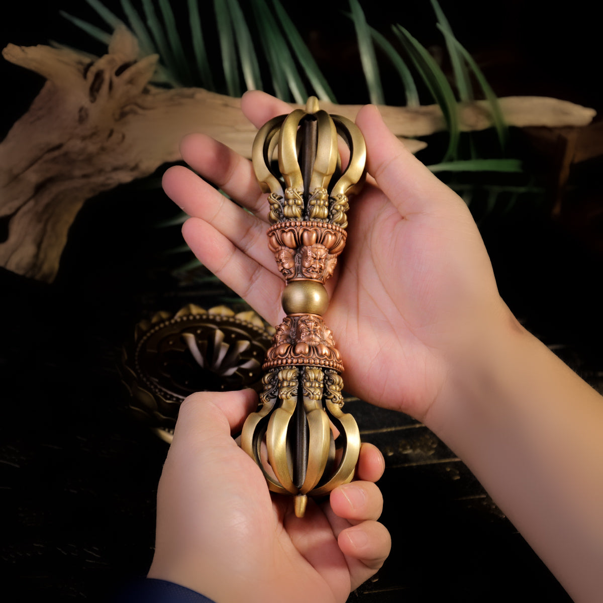 This handcrafted 21cm Nine-Pronged Vajra, made from brass and copper, with a base, is an exquisite piece of Tibetan Buddhist art, perfect for spiritual practitioners and collectors alike.