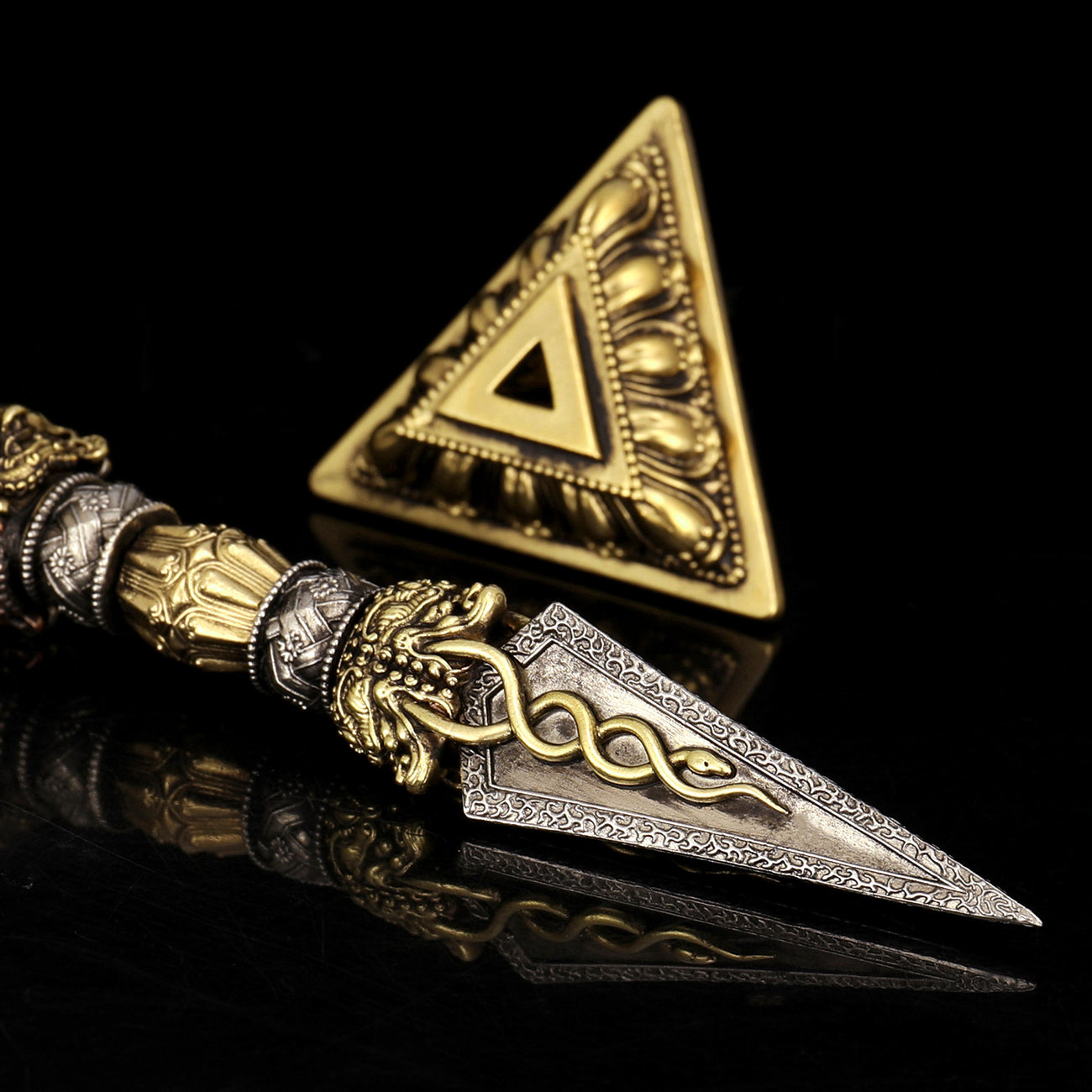 This 21cm handcrafted Purba Vajra Dagger, made from brass, copper, and white copper, is a symbolic tool in Tibetan Buddhist rituals. It enhances meditation, ritual ceremonies, and spiritual protection with its traditional craftsmanship.