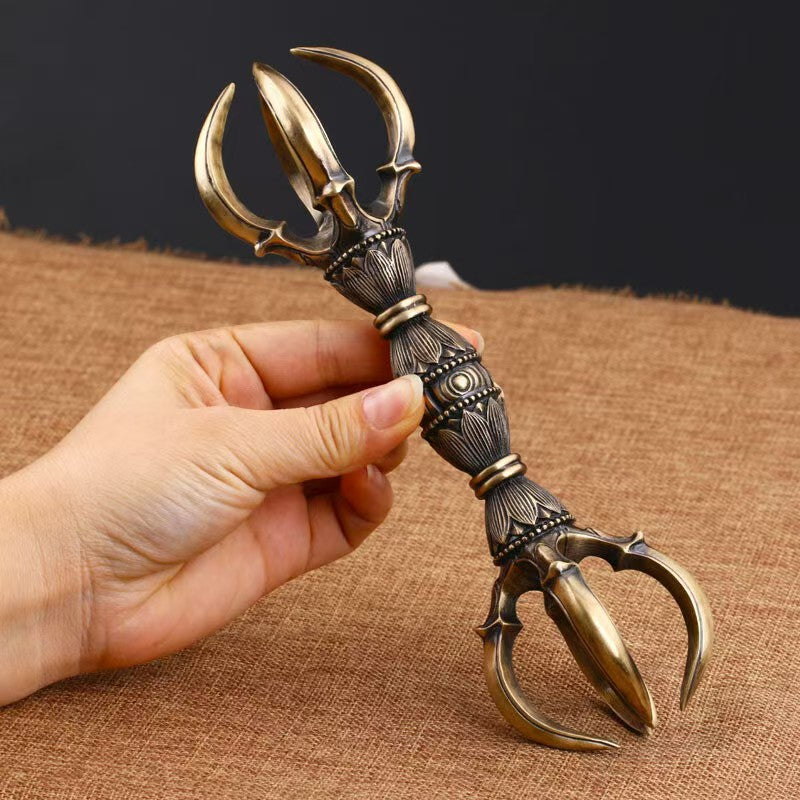 "Brass Five-Prong Vajra, handcrafted for Tibetan Buddhist rituals. A sacred tool representing the triumph of wisdom and protection, perfect for meditation spaces."