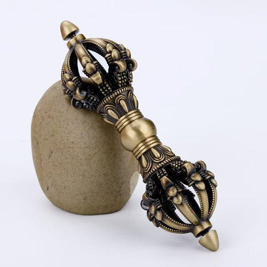 Brass Five & Nine-Prong Vajra, meticulously handcrafted to represent the power of Tibetan Buddhist rituals. Ideal for enhancing your altar, meditation room, or spiritual home decor.
