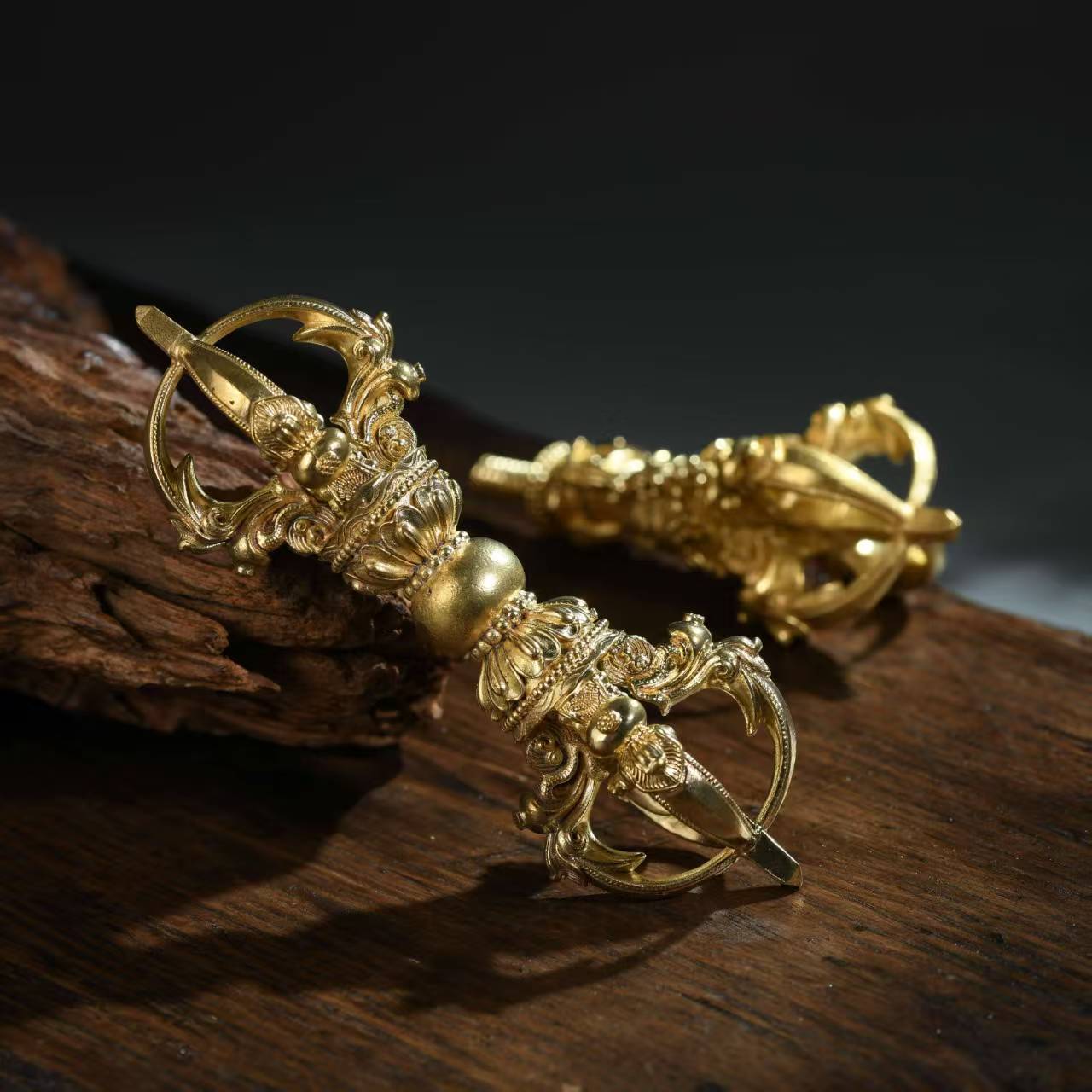 A brass five-pronged Phurba Vajra, handcrafted by skilled artisans in Nepal. This tool is a powerful symbol of protection, purification, and spiritual balance. Essential for your Tibetan Buddhist altar and meditation space.