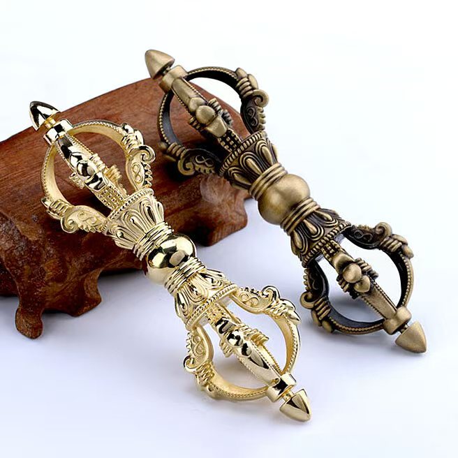 Brass Nine-Pronged Vajra, a ritual art sculpture that embodies spiritual protection and wisdom. Perfect for Buddhist altars, meditation spaces, and ritual practices in Tibetan Buddhism.
