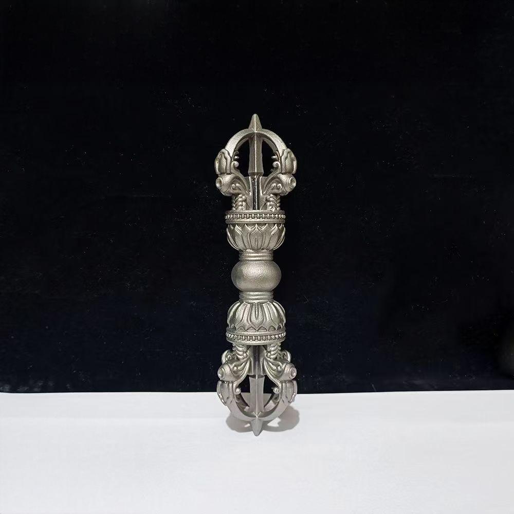 This Five-Pronged Vajra, crafted from brass with meteorite details, embodies the deep cultural and spiritual strength of Tibetan Buddhism. Each piece is meticulously carved, perfect for religious ceremonies, home decor, or as a devotional item for followers, offering positive energy and protection.