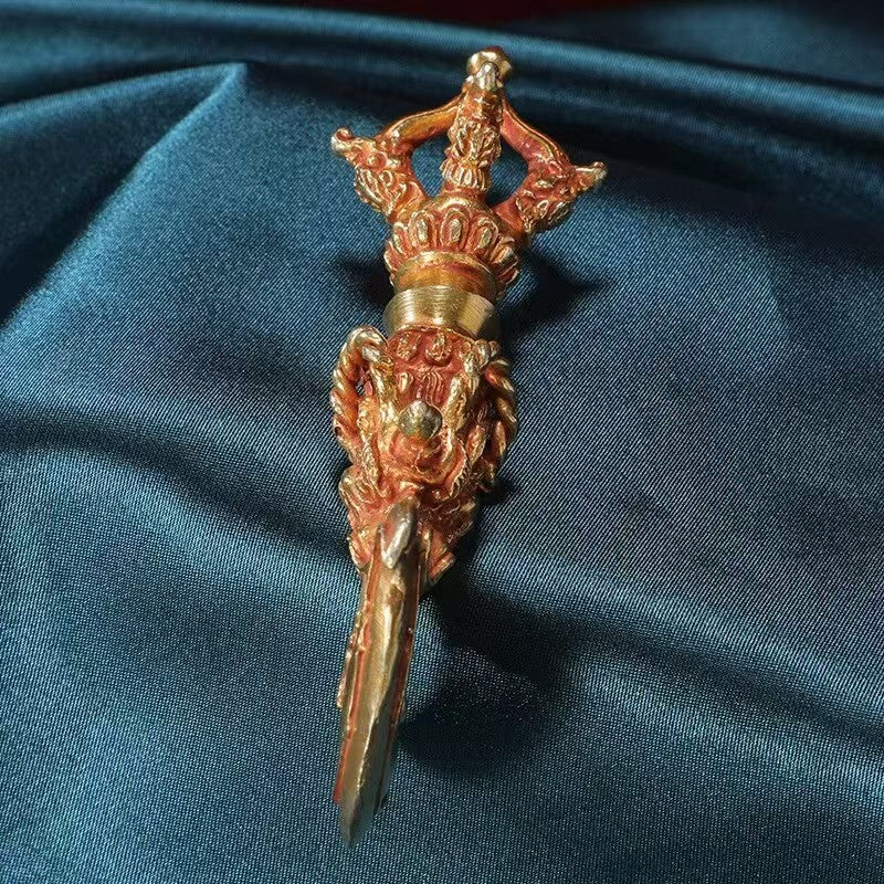Handcrafted brass Vajra with a human face, embodying the power and protection of Tibetan Buddhist ritual art. Ideal for rituals, meditation, and as a sacred decorative piece for your altar or spiritual space.