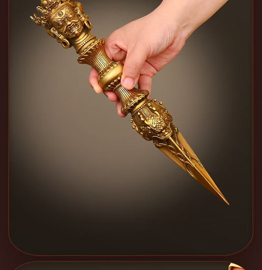 This exquisite handcrafted brass Mahakala Phurba Vajra is a powerful symbol in Tibetan Buddhism. Made with precision and care, it serves as a spiritual tool for meditation and protection. Crafted from high-quality brass, it embodies both beauty and function, perfect for ritual use or as a decorative piece in any sacred space.