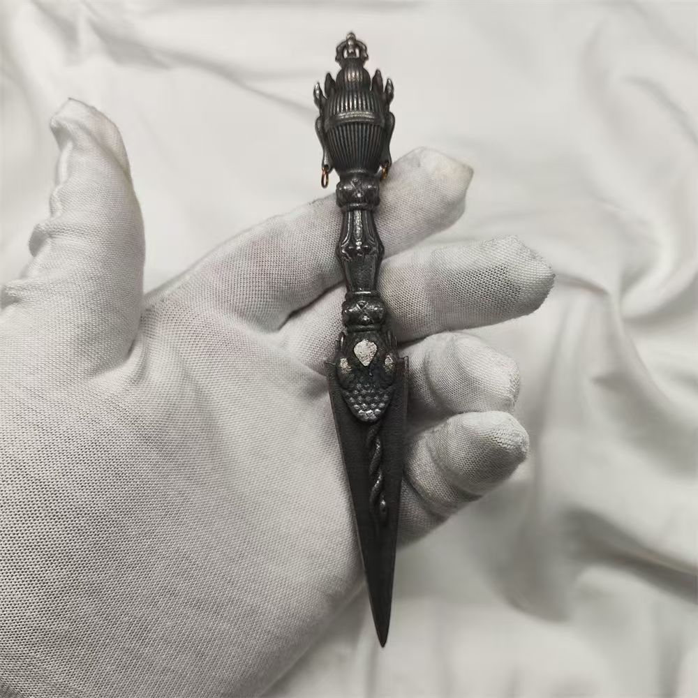 Handmade brass Vajra Phurba inspired by Tibetan Buddhist ritual implements culture, representing spiritual protection and traditional Buddhist ritual art.