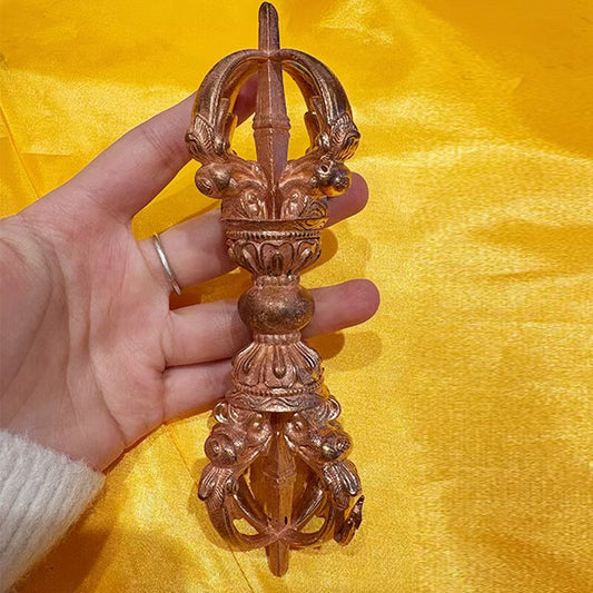 This handcrafted brass Five-Pronged Phurba Vajra is a sacred Tibetan Buddhist tool used for demon-slaying and purification. Perfect for enhancing the spiritual atmosphere of your Tibetan Buddhist altar or meditation space.