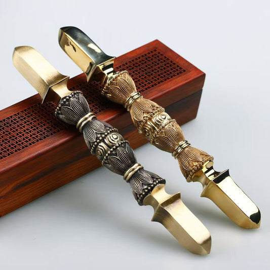 Handcrafted brass single-prong Vajra, an exquisite Tibetan Buddhist ritual art sculpture. Perfect for enhancing spiritual spaces, meditation rooms, and as a cultural artifact