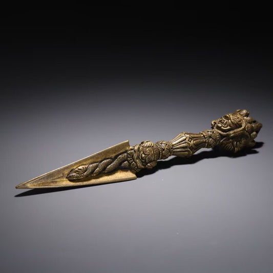 Description: Discover the divine power of the Brass Three-Prong Mahakala Vajra, a Tibetan Buddhist ritual implement that symbolizes spiritual strength and protection. Expertly handcrafted with intricate detail, this brass vajra is perfect for use in meditation, rituals, and Buddhist ceremonies. A must-have piece for those seeking to deepen their spiritual practice. Its unique design embodies the essence of Tibetan Buddhist art and culture, making it a stunning addition to any sacred space.