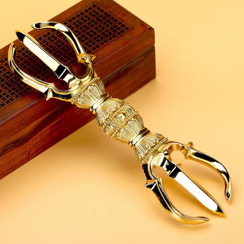 Handcrafted Brass Three-Prong Vajra, representing spiritual empowerment and enlightenment in Tibetan Buddhism. Ideal for meditation, rituals, and sacred spaces