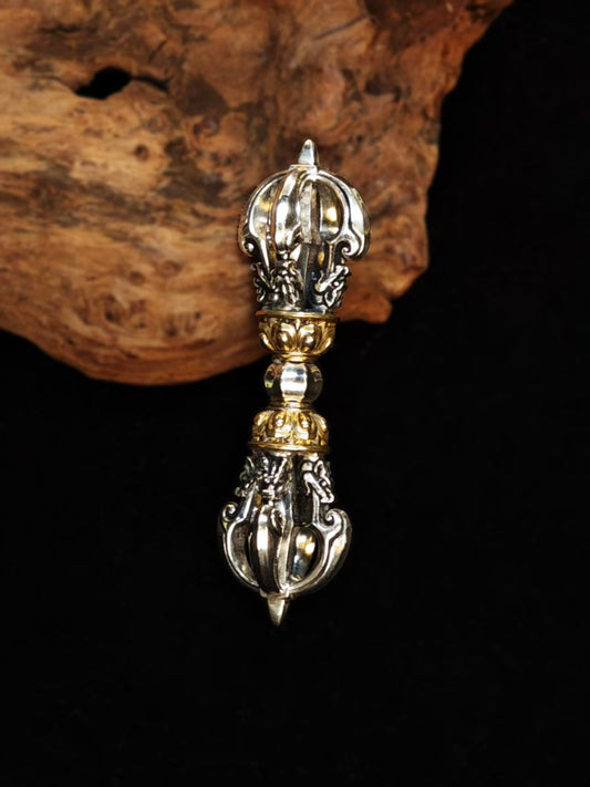 : Handcrafted brass Vajra charm, symbolizing spiritual strength and protection. This retro pendant is a fusion of Tibetan Buddhist culture and vintage style, ideal for spiritual practices and meditation.