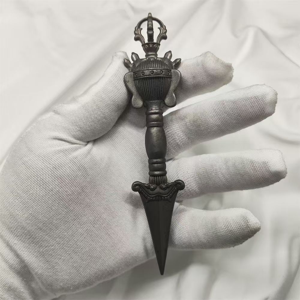 Handcrafted brass Phurba, designed for East Tibetan mantra rituals, symbolizing purification, protection, and spiritual transformation through its powerful design.