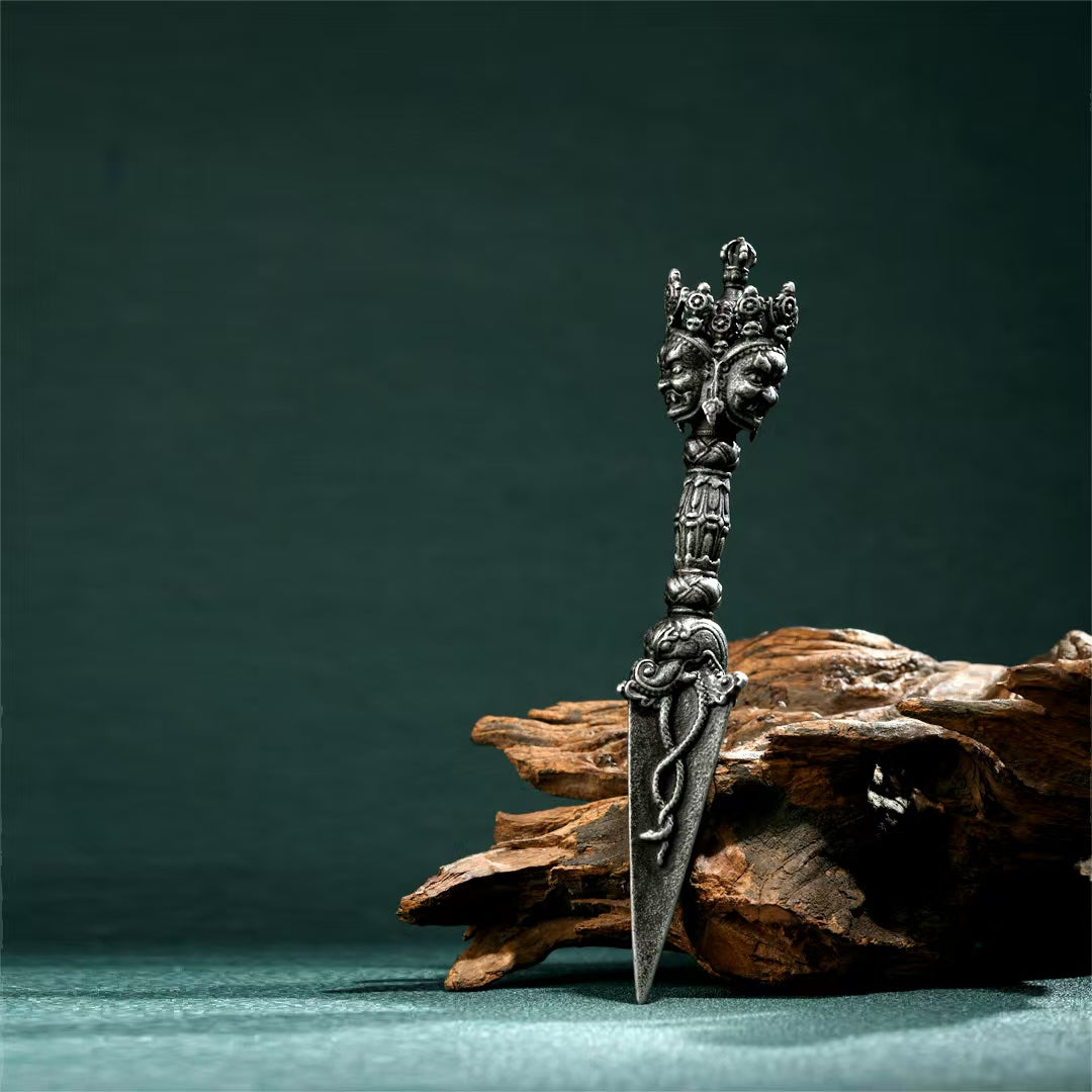 Brass Vajra Phurba with Gessho Flower, handcrafted for rituals. A Tibetan Buddhist tool for spiritual protection, purification, and enhancing altar spaces.