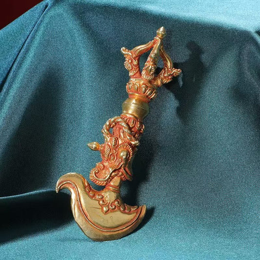 Handcrafted brass Vajra featuring a gold-plated dragon head, representing protection and spiritual strength. Ideal for Tibetan Buddhist rituals, meditation, and as a meaningful addition to your collection of spiritual art.