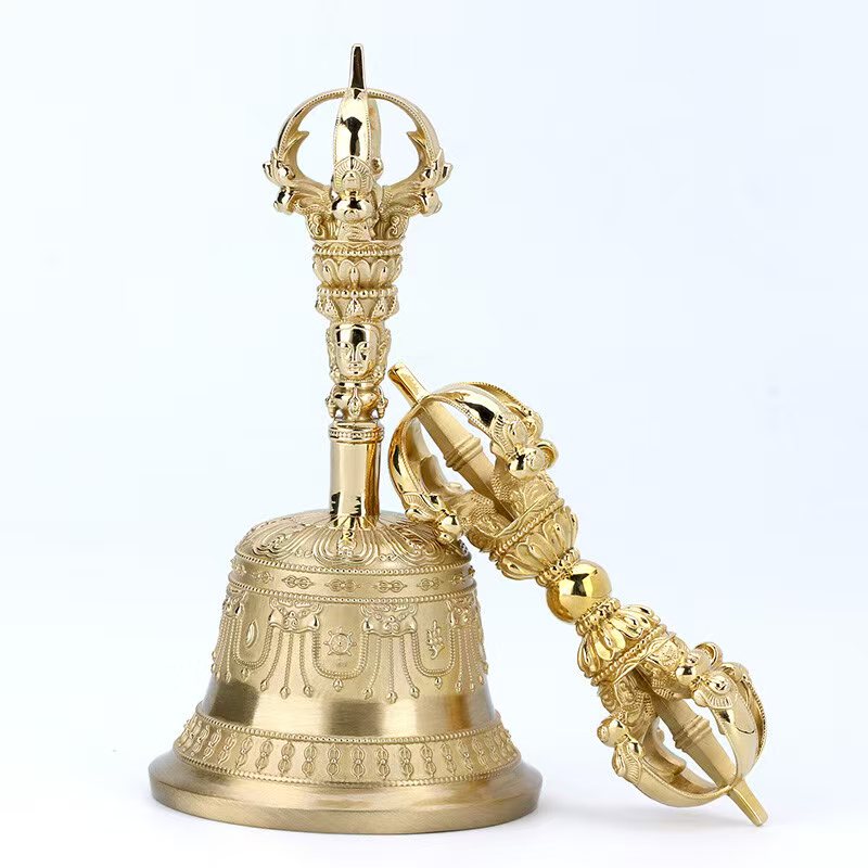 This handcrafted Brass Vajra Bell with Nine Bells is a stunning embodiment of Tibetan Buddhist ritual implements culture. It symbolizes the sacred power of Buddhist instruments, ideal for spiritual practice and as a valuable addition to any collection.