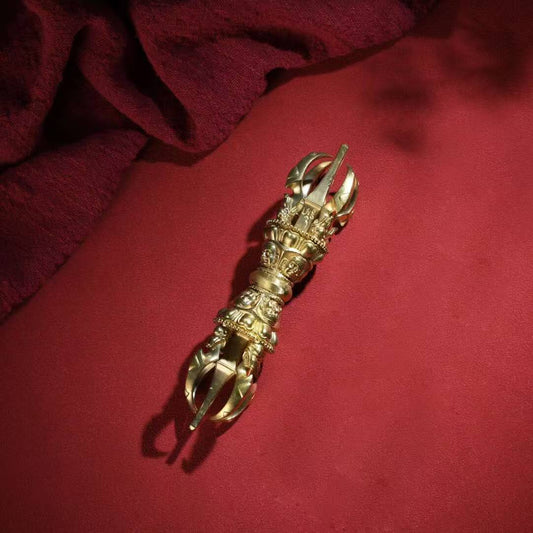 Handcrafted five-pronged brass Phurba Vajra from Tibetan Buddhist ritual implements culture, symbolizing spiritual protection and demon-subduing power.