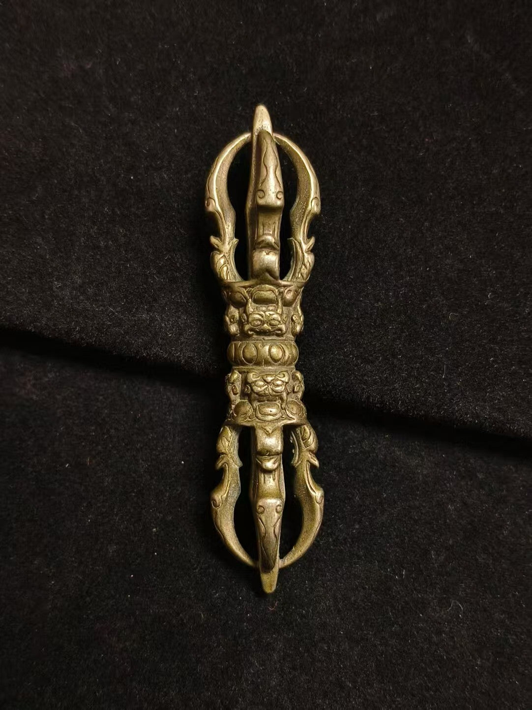 Exquisite handcrafted brass five-pronged Vajra, a symbol of spiritual power and protection. Perfect for Tibetan Buddhist rituals or as a beautiful, sacred piece of spiritual art for any collection.