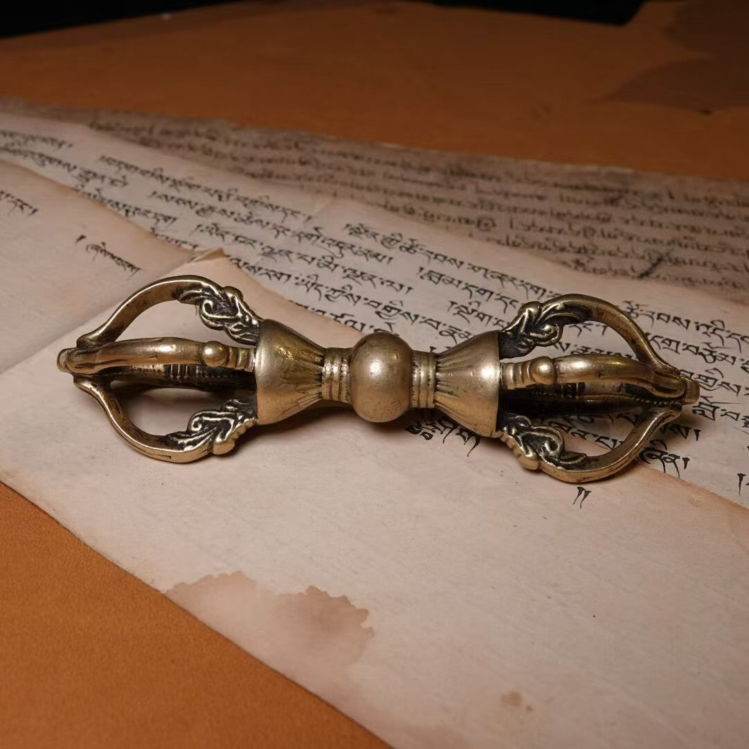 A handcrafted five-pronged Vajra in brass, reflecting Tibetan Buddhist tradition. This ritual tool is ideal for home decoration, bringing spiritual energy and sacred meaning to any space.