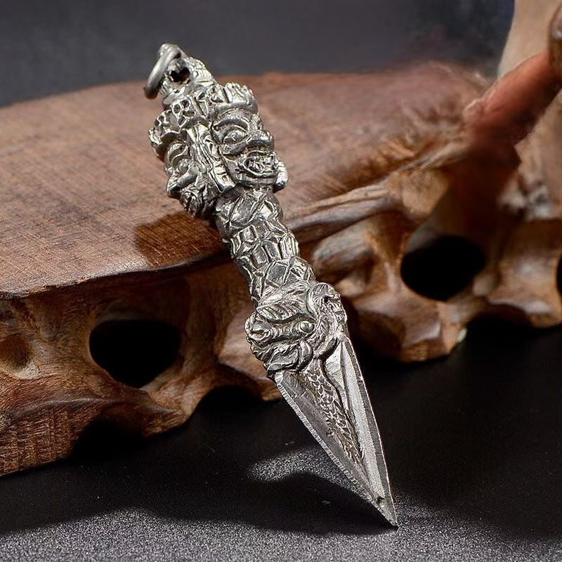 This Handcrafted Iron Flower Vajra represents strength, wisdom, and spiritual enlightenment. Crafted in Nepal with antique brass, it is a sacred ritual tool for Tibetan Buddhists. The Phurba Dagger is used to clear obstacles and purify energies, making it an essential item for meditation and rituals. A perfect addition to any Buddhist altar or spiritual collection, this piece blends craftsmanship with divine purpose.