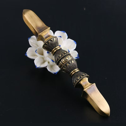 Exquisite brass single-prong Vajra, handcrafted with attention to detail. A powerful ritual sculpture, bringing spiritual energy and protection to your home or meditation space.