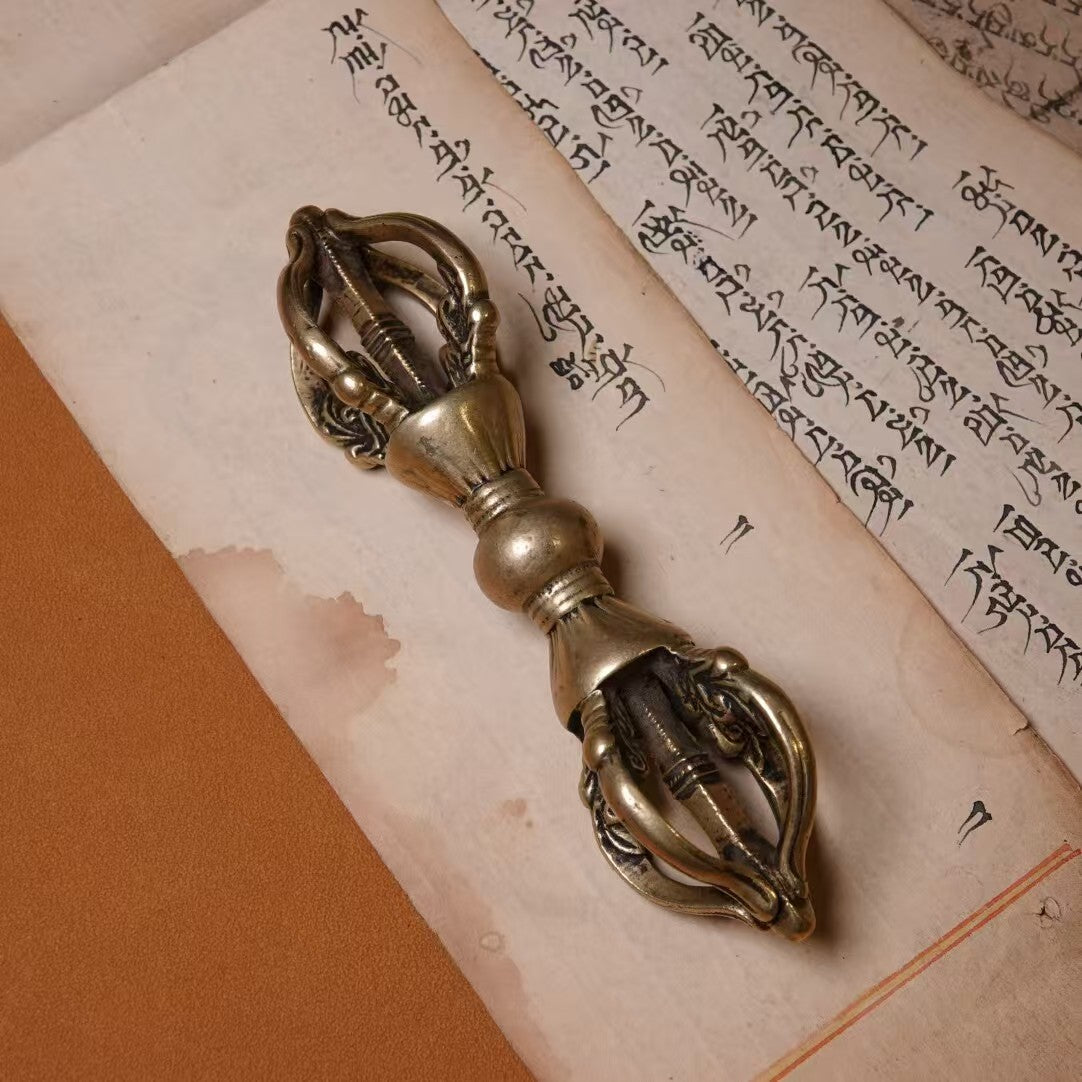 : A meticulously handcrafted five-pronged Vajra, inspired by the Qing Dynasty. Made from brass, this ritual tool represents spiritual protection and power, perfect for meditation or sacred spaces.