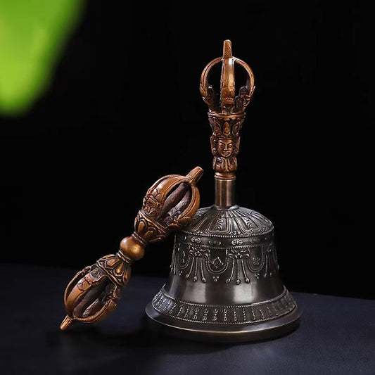This handcrafted five-pronged Vajra bell, featuring a Nepalese style, combines brass material with Tibetan Buddhist ritual art, making it a meaningful decorative and collectible item with profound religious significance.