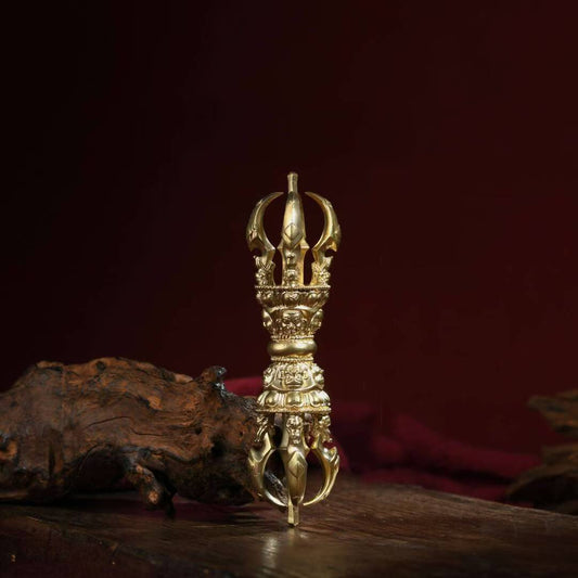 Handmade Nepalese brass Phurba Vajra, used in Tibetan Buddhist rituals for purifying energy and subduing negative forces, embodying sacred ritual art.