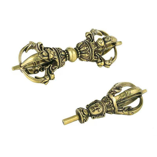 Handcrafted brass vajra for demon subduing, inspired by Tibetan Buddhist ritual implements culture, symbolic Buddhist ritual implements art for protection and focus.