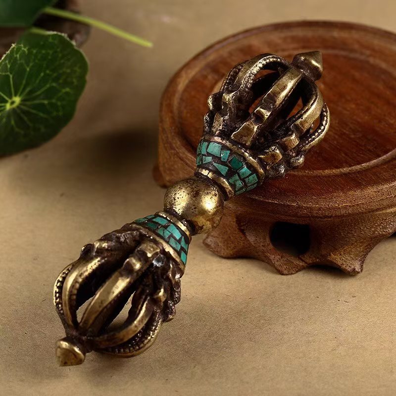 Brass nine-pronged Vajra ornament with turquoise inlay, handcrafted according to Tibetan Buddhist ritual implements culture, representing authentic Buddhist ritual implements art.