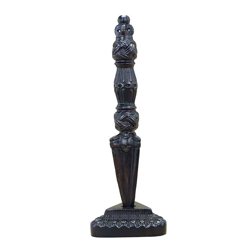 Handcrafted brass Phurba Vajra with wooden base, inspired by Tibetan Buddhist ritual implements culture, showcasing traditional Buddhist ritual implements art.