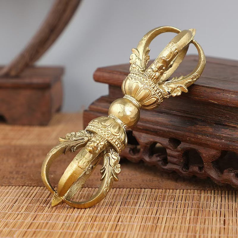 Handmade brass five-pronged vajra, representing Tibetan Buddhist ritual implements culture, used for spiritual protection and purification, featured in Buddhist ritual implements art.