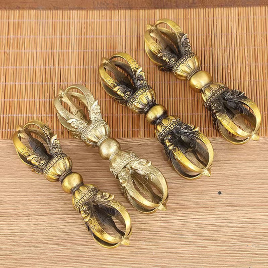 Traditional brass five-pronged vajra, reflecting Tibetan Buddhist ritual implements culture, offering spiritual protection and enhancing meditation in Buddhist ritual implements art.