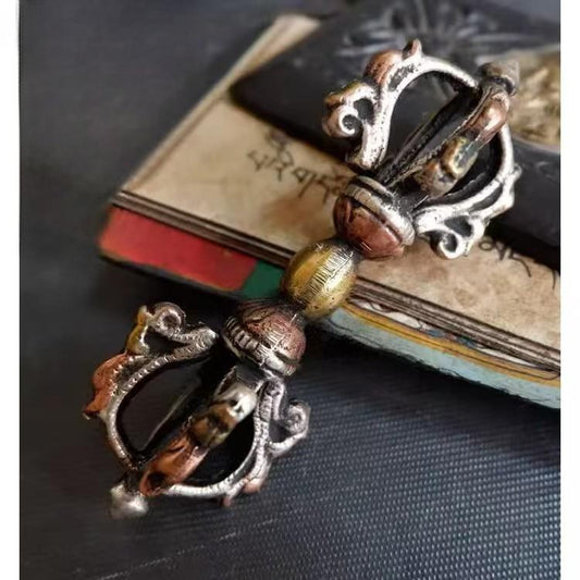 Traditional Nepalese tricolor five-pronged vajra, crafted from brass, representing Tibetan Buddhist ritual implements culture and serving as a powerful tool in Buddhist ritual implements art.