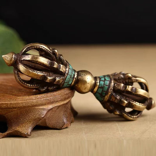 Traditional brass nine-pronged Vajra with turquoise, handcrafted in Tibetan Buddhist ritual implements culture style, reflecting genuine Buddhist ritual implements art.