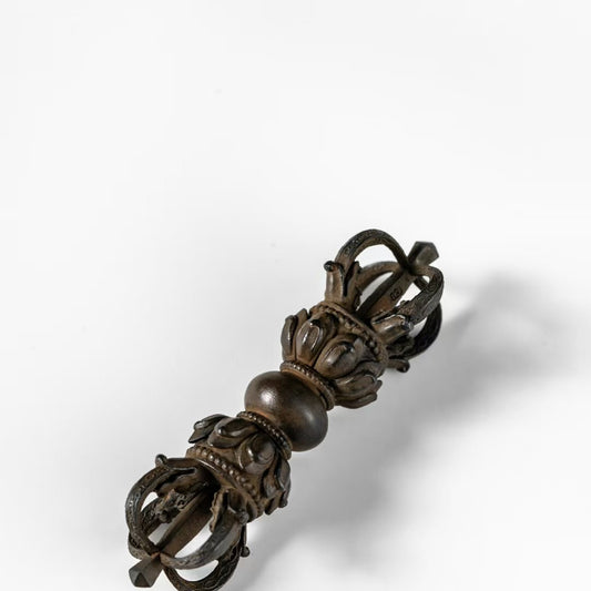 Traditional brass Vajra with copper heat-treated finish, reflecting Tibetan Buddhist ritual implements culture and authentic Buddhist ritual implements art craftsmanship.