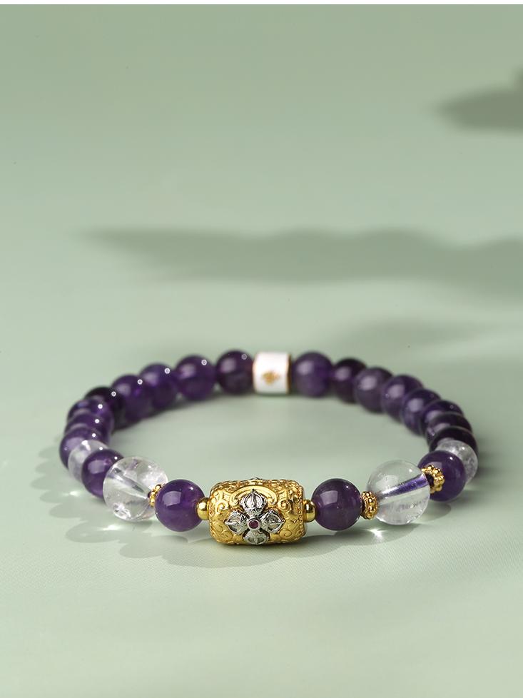 An artistic amethyst and clear quartz bracelet from Tibetan Buddhist jewelry culture. Handcrafted with love and dedication, this piece channels energy for healing and enlightenment.