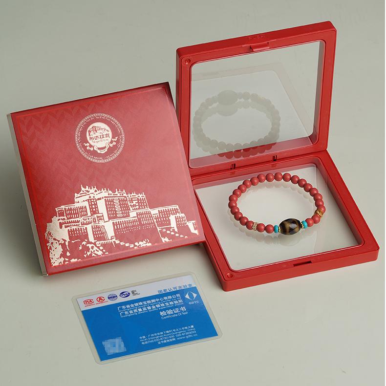 Cinnabar charm bracelet reflecting Tibetan Buddhist jewelry culture with hand-painted craftsmanship, symbolizing protection, prosperity, and spiritual beauty.