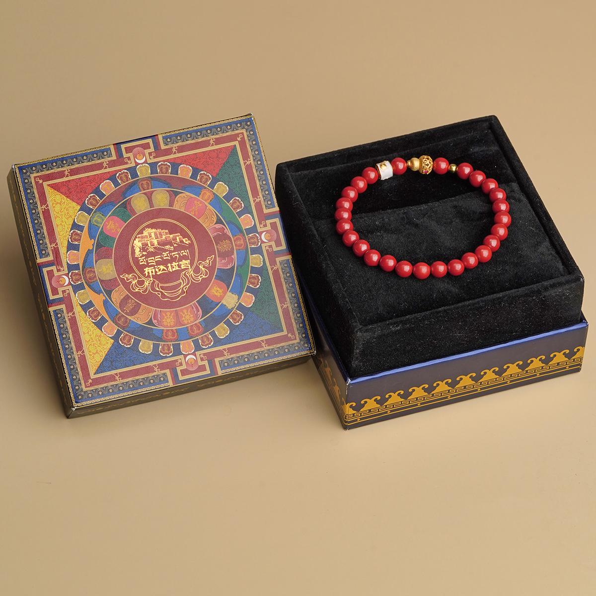Tibetan-inspired hand-painted cinnabar bracelet reflecting Tibetan Buddhist jewelry culture, with detailed artistry and vibrant red hues.