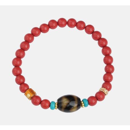 Hand-painted cinnabar mala bracelet inspired by Tibetan Buddhist jewelry culture, showcasing artisan detailing and spiritual jewelry art.