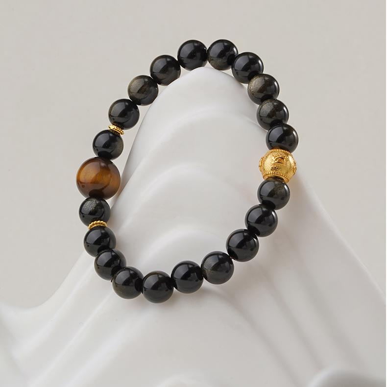 This hand-painted goldstone and tiger eye bracelet channels positive energy, enhancing spiritual well-being and balance. A beautiful piece of Tibetan jewelry art.