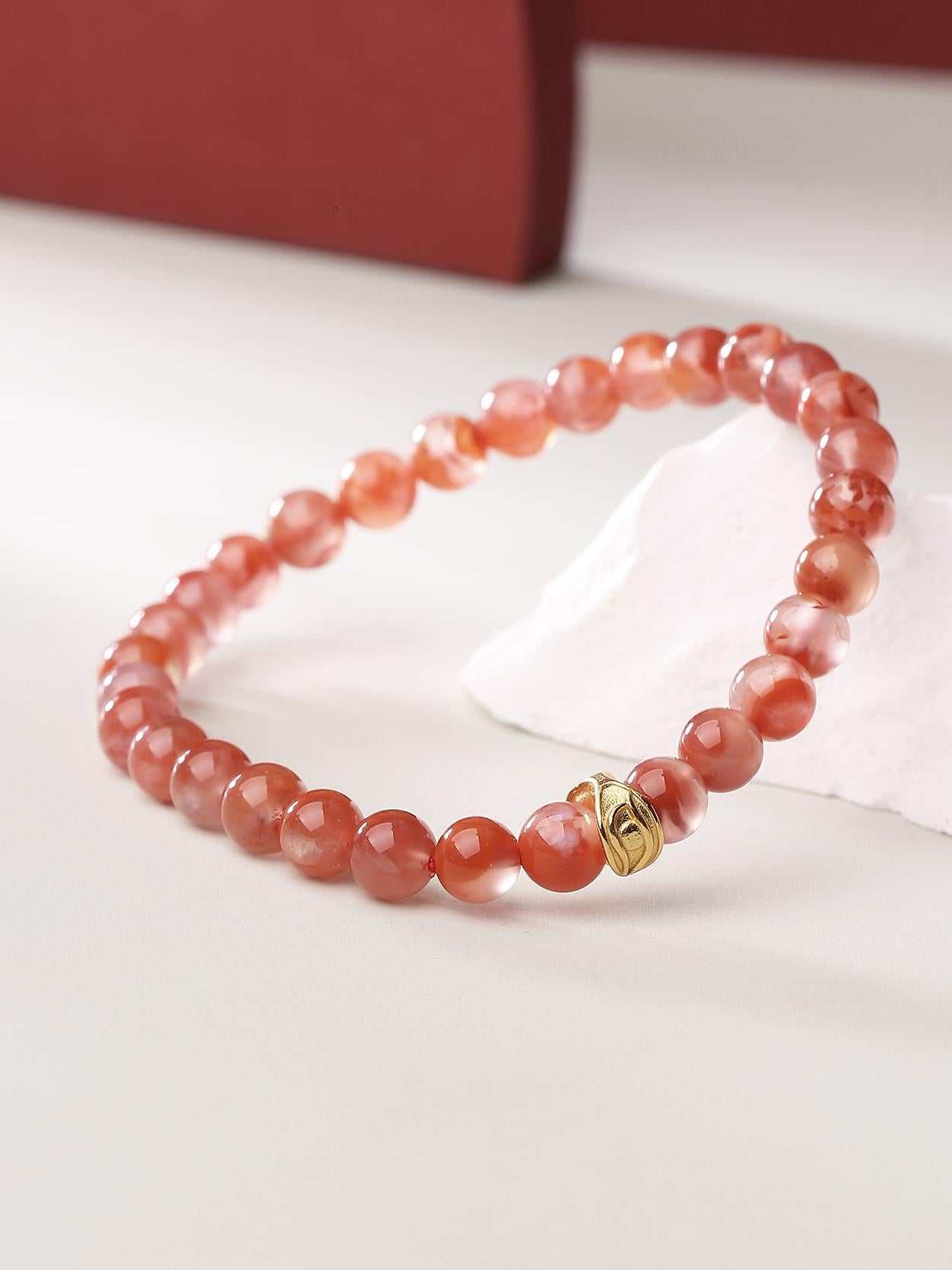 Hand-painted with intricate details, this red agate bracelet showcases the Eye of Wisdom design. A beautiful representation of Tibetan Buddhist artistry and spiritual strength.