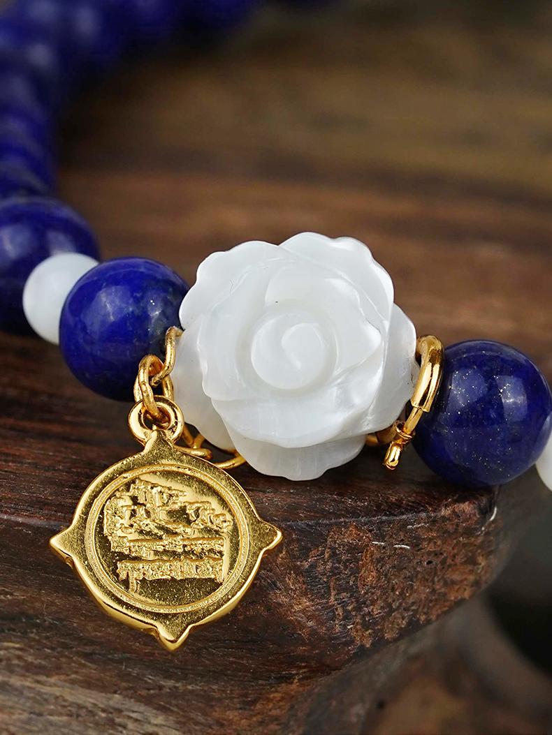 Lapis lazuli and shell floral bracelet showcasing Tibetan Buddhist Jewelry Culture design and delicate handmade jewelry art techniques.