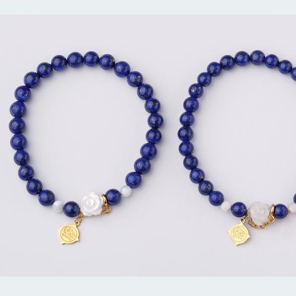 Hand-painted lapis lazuli and carved shell bracelet capturing Tibetan Buddhist Jewelry Culture elements and refined artisan jewelry art.