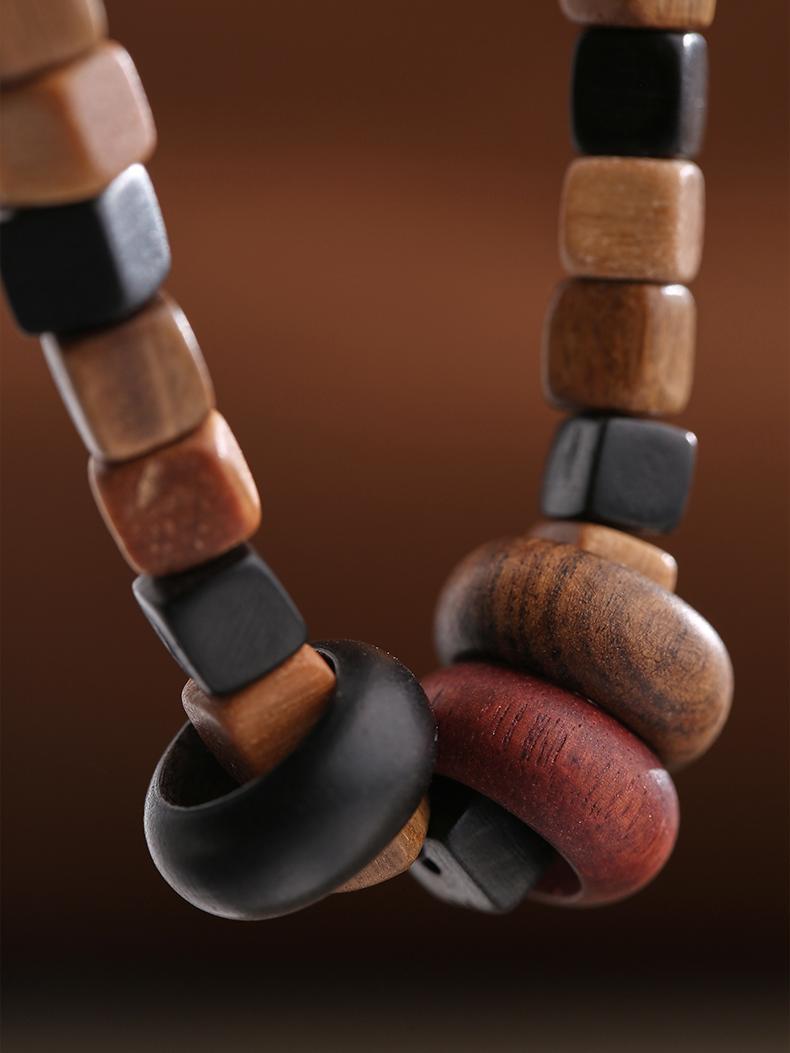 Pure hand-painted sandalwood square bead bracelet inspired by Tibetan Buddhist Jewelry Culture. Represents grounding energy, serenity, and traditional spiritual craftsmanship.