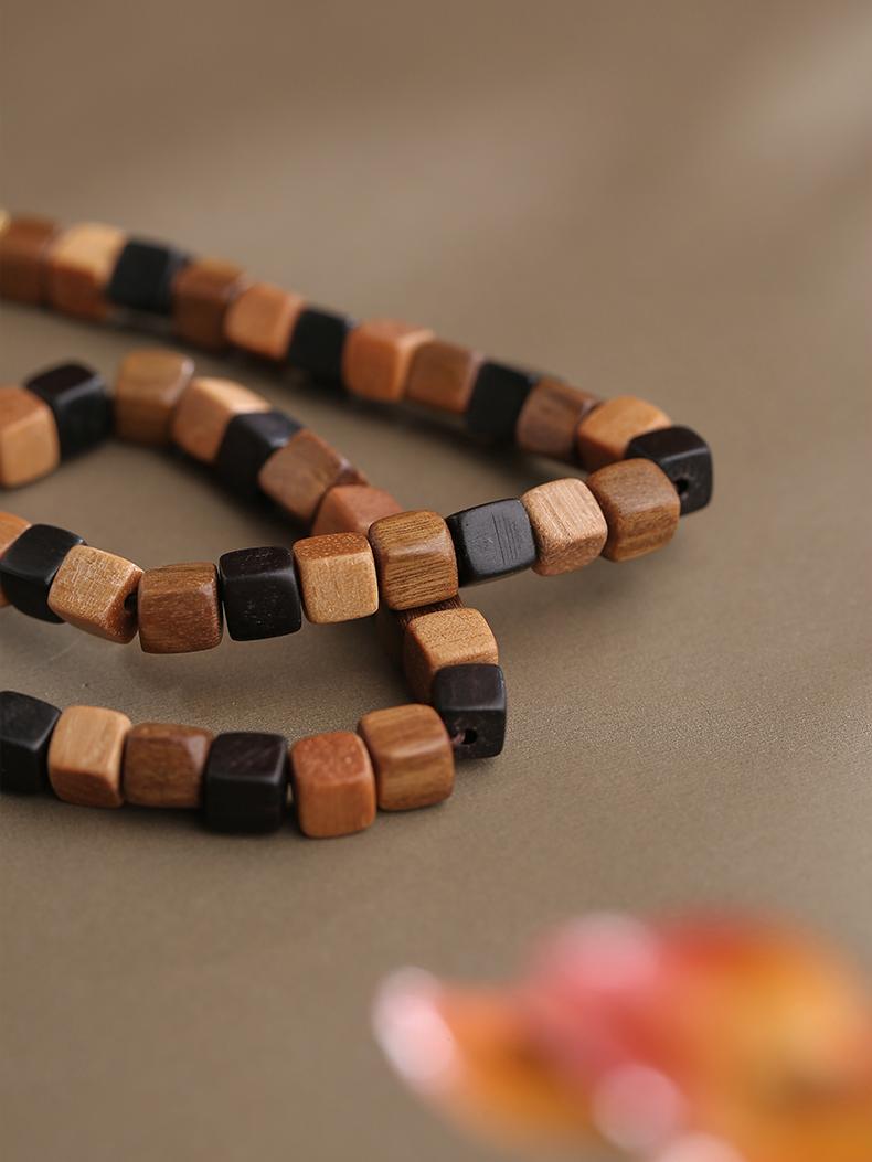 Tibetan Buddhist sandalwood square multi-layer bracelet, 100% handcrafted. Embodying purity and strength, this Jewelry Art piece enhances focus and calmness.