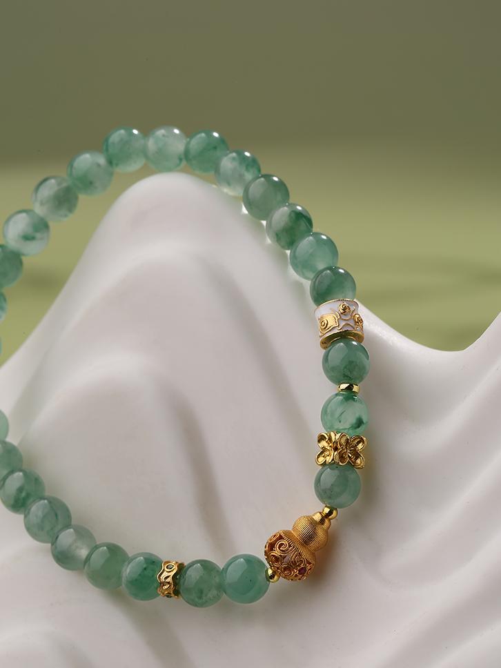 A unique African jade bracelet that combines Tibetan symbolism with intricate craftsmanship. This piece is perfect for those seeking spiritual guidance, balance, and wisdom.