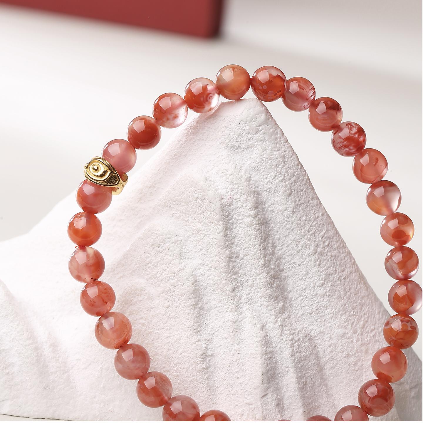 This unique red agate bracelet features the Eye of Wisdom and is inspired by Tibetan jewelry art. Perfect for those who seek enlightenment and spiritual empowerment.