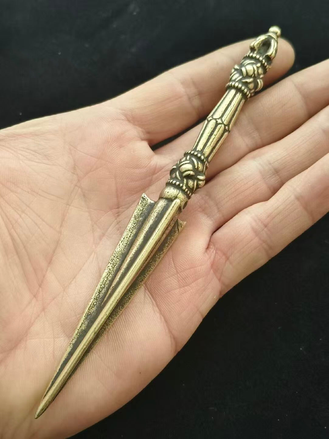This handcrafted Tibetan Buddhist Vajra Purba ritual implement is made from high-quality brass. With deep cultural significance, it symbolizes the dispelling of evil and protection of sacred teachings, perfect for worship and as a decorative piece.
