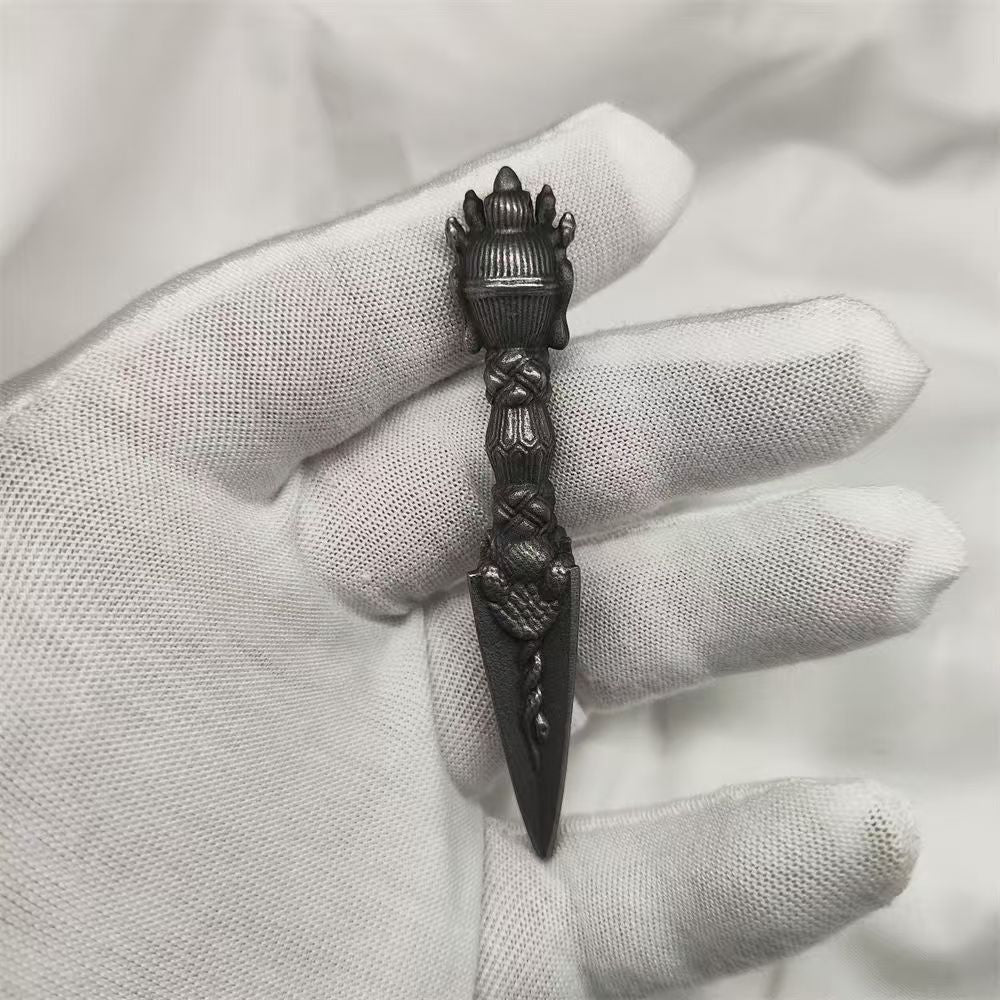 Handmade brass Phurba, symbolizing purification and spiritual transformation, crafted in Tibetan Buddhist ritual implements culture, perfect for spiritual protection.